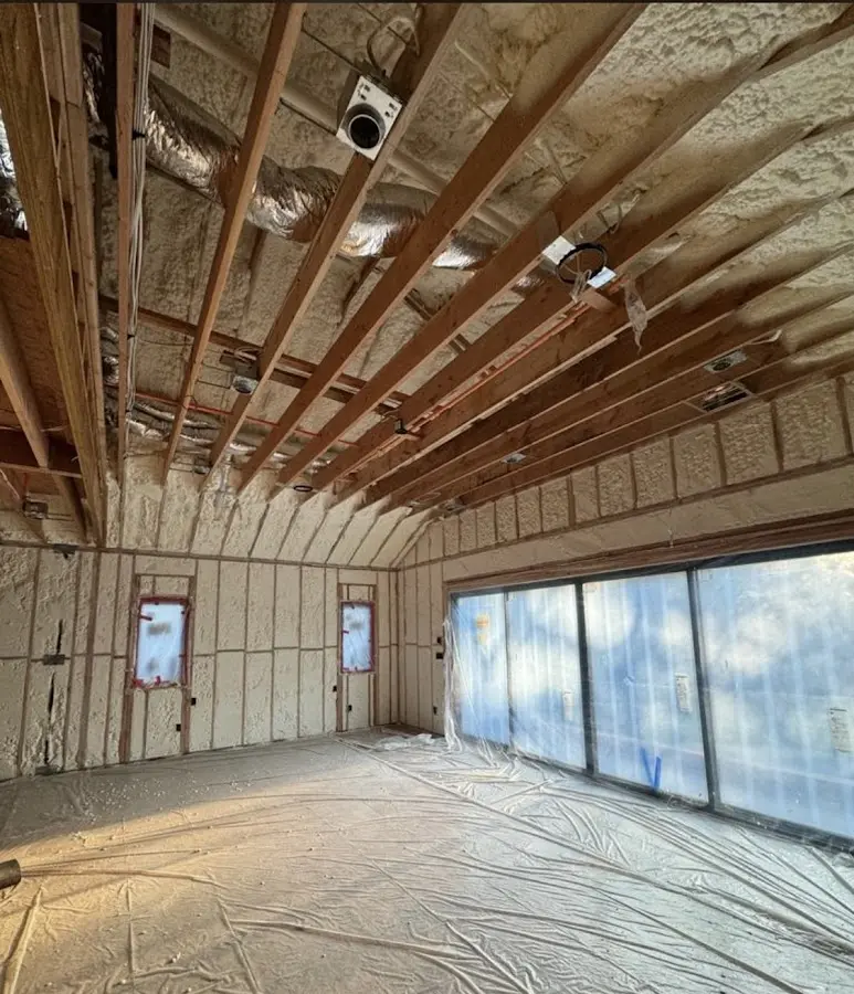 Interior walls and ceiling insulated with spray foam during new construction in East Camden